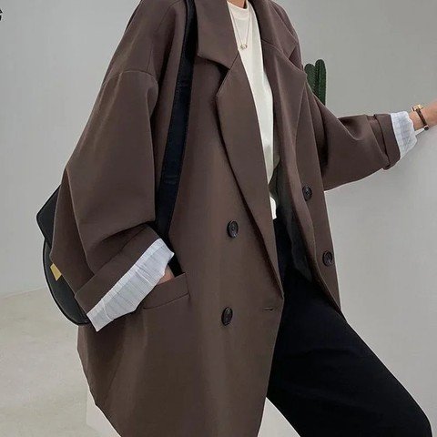 Woman wearing the Double-Breasted Relaxed Blazer in dark brown