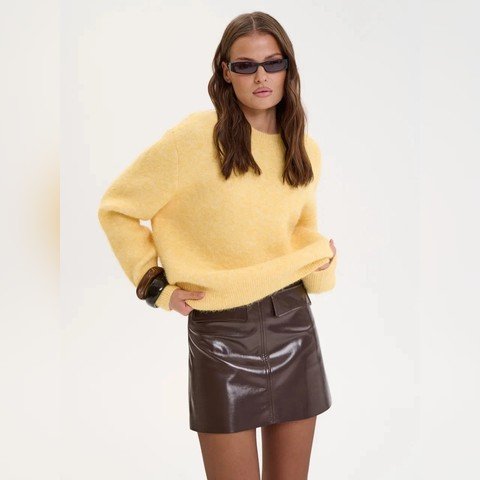 Woman wearing the Relaxed Crew Neck Jumper in yellow
